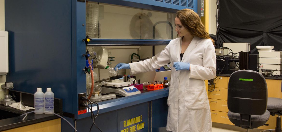 engineering student wears lab coat