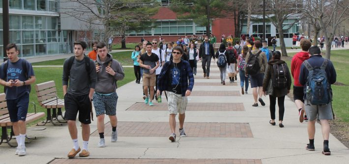 Students walking on Campus in Front of the Savitz Hall