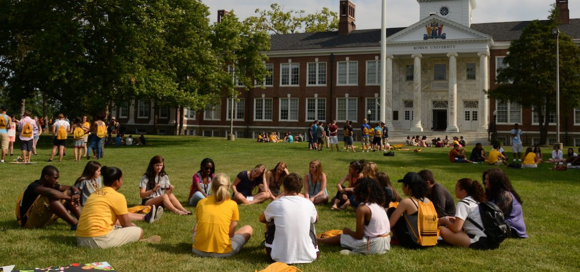 A group of PROS rowan students sitting in a circle outside Bunce Hall