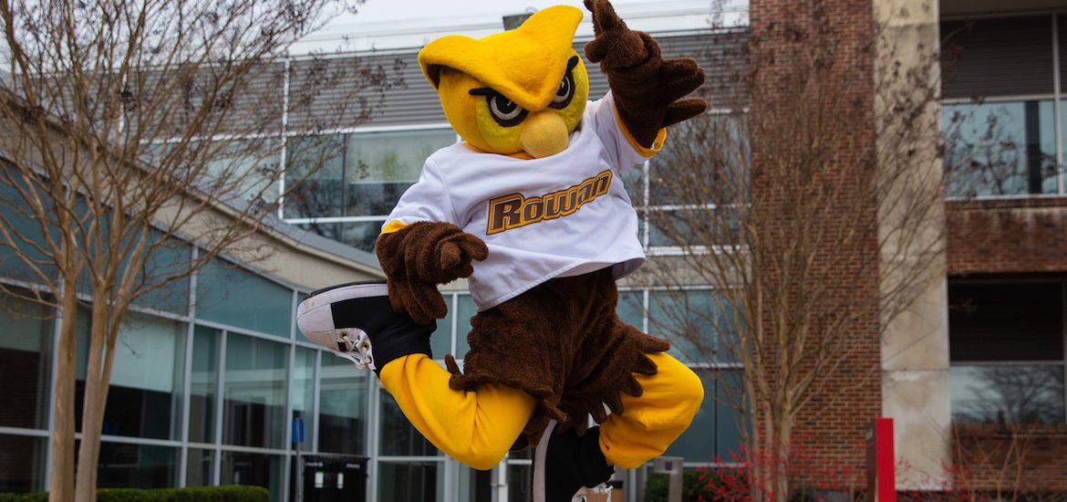 Rowan mascot jumps for joy outside of Savitz Hall at Rowan University