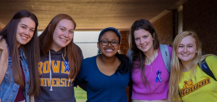 Hajah and four friends stand in the underpass at Willow Hall.