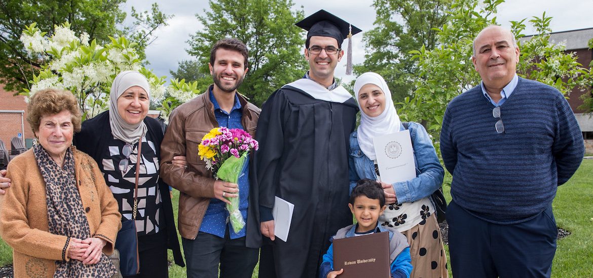 Ahmad Kindawi stands with his family at Rowan University graduation
