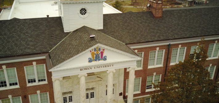 Drone view of brick and white columns of Bunce Hall.