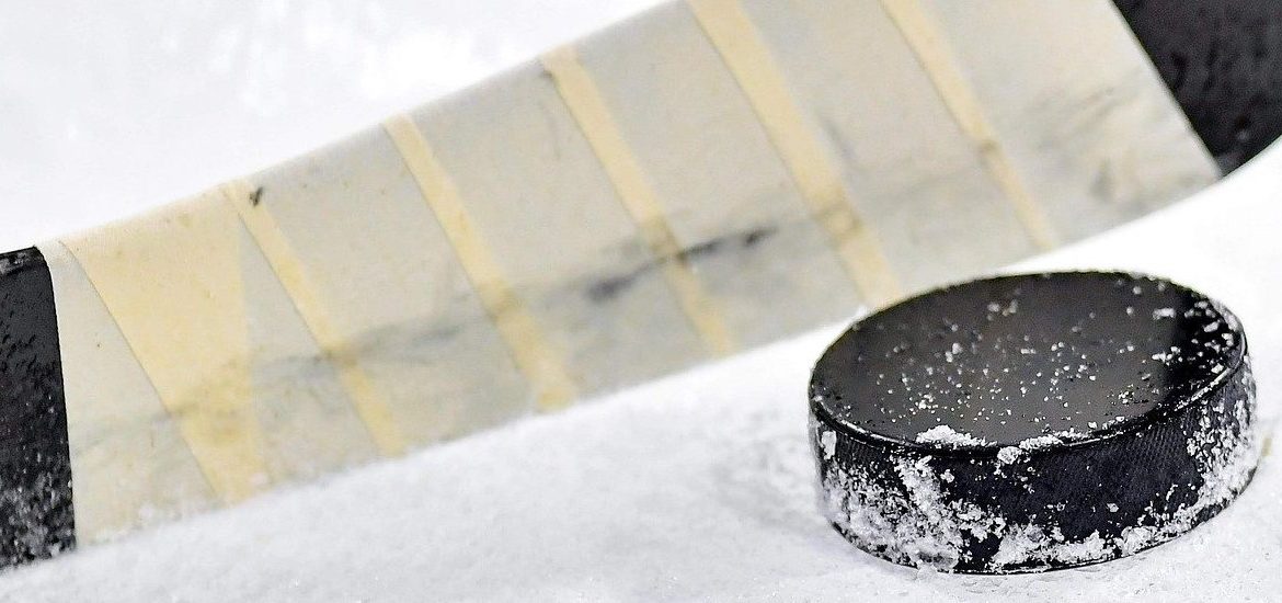 Stock image of a hockey stick and puck