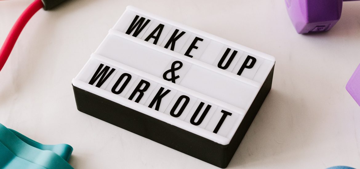 A sign that says Wake up and Workout.