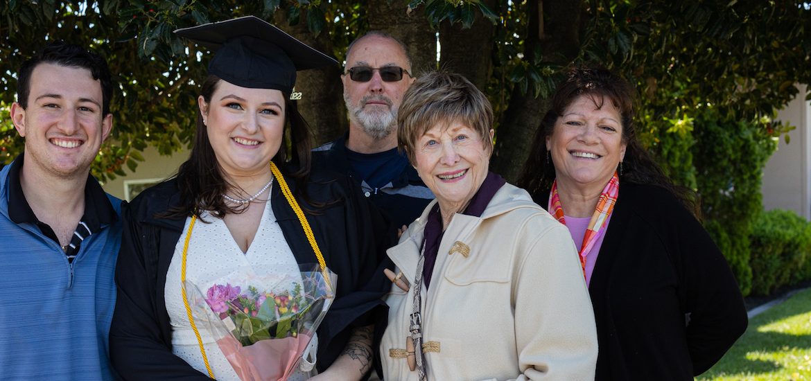 Carly with family at her graduation.