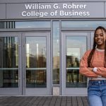 Lanasia stands outside the Rohrer College of Business building.