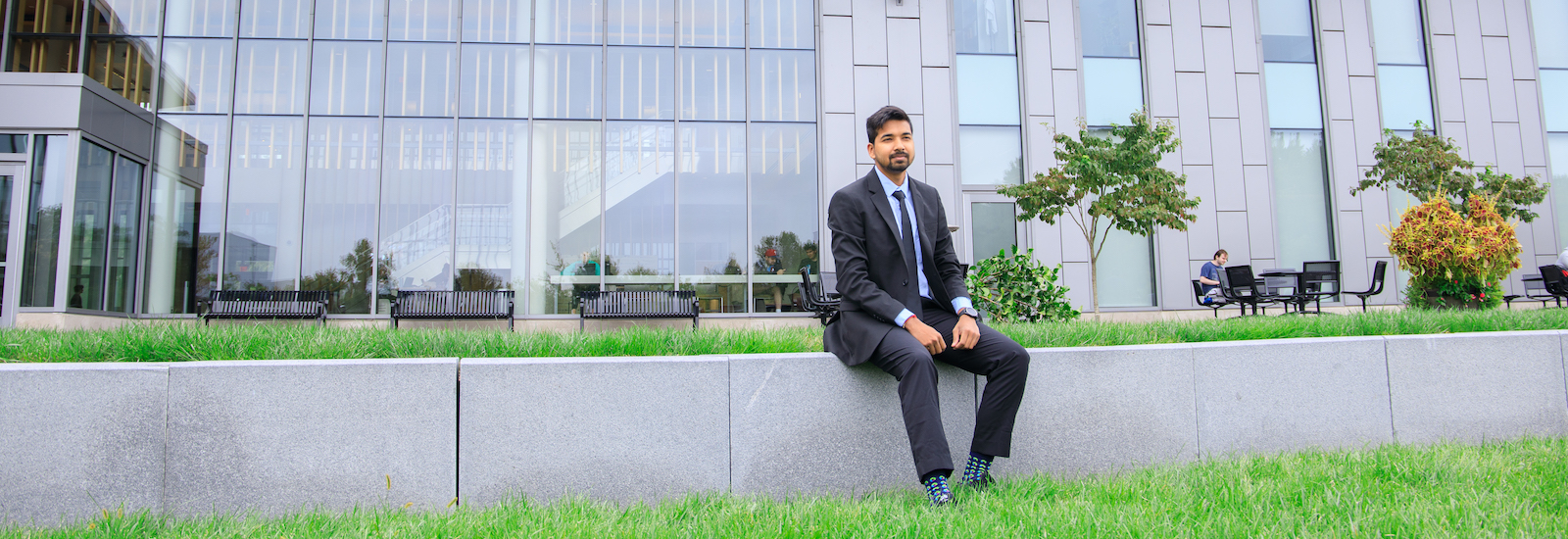Somyaranjan Rout sits behind business hall.